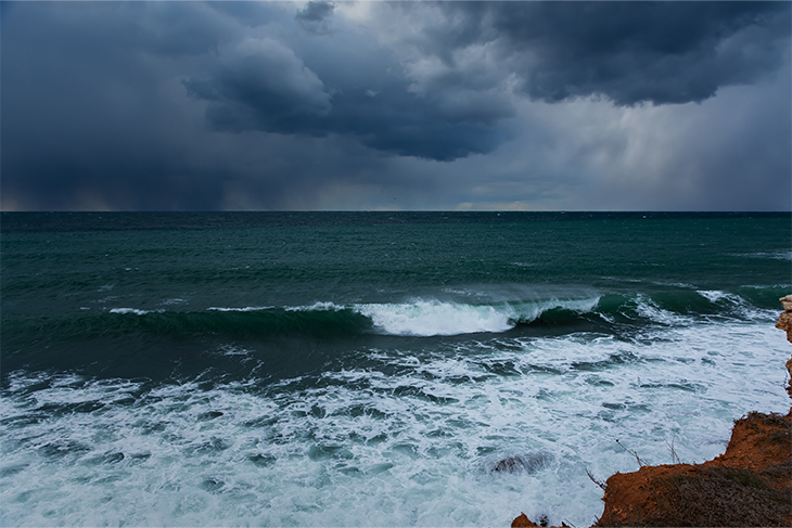 Stormy skies overlook ocean waters